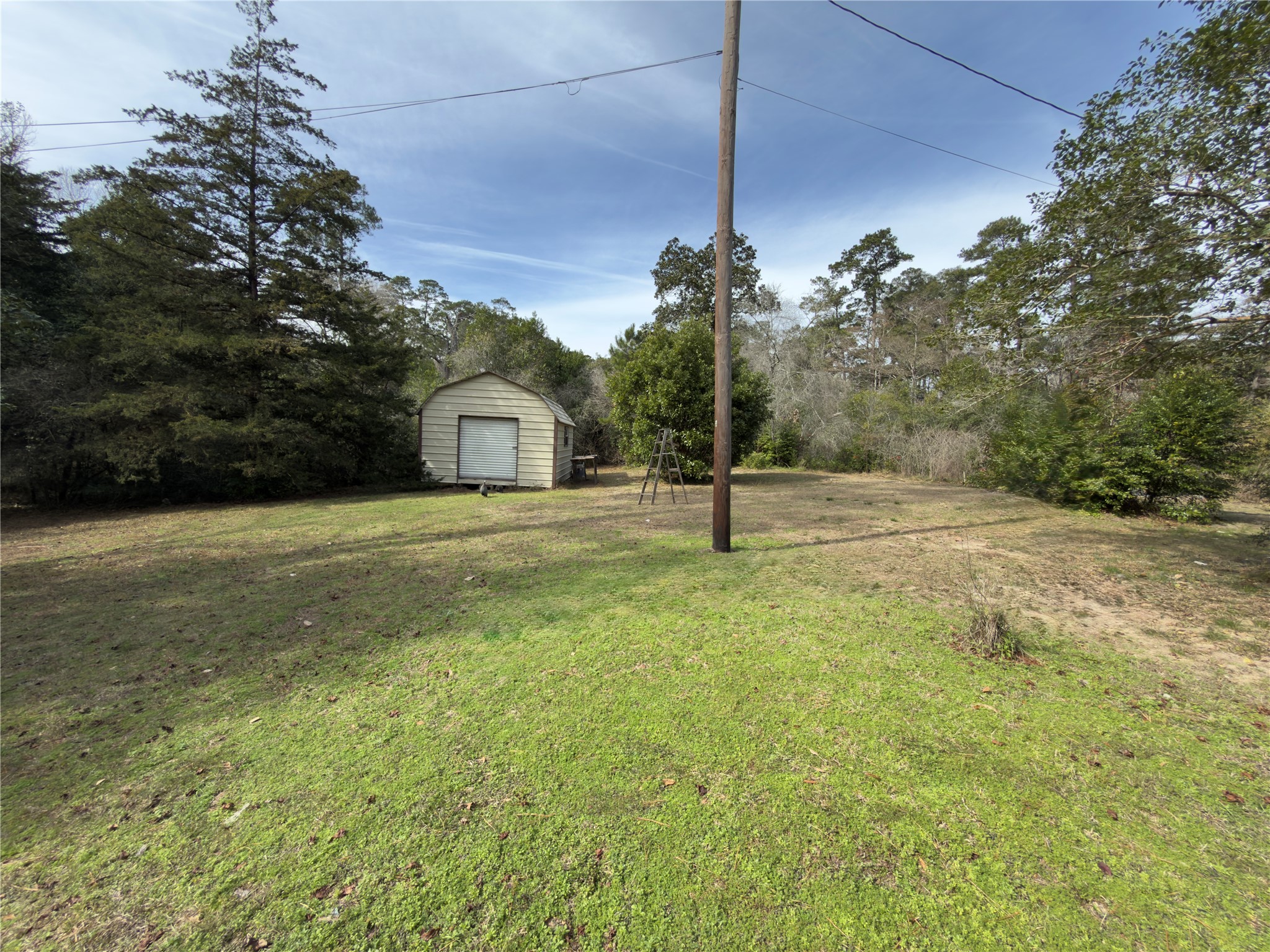 257 County Road 2142 Cleveland, TX 77327 - Photo 7 of 18 a view of a house with a park