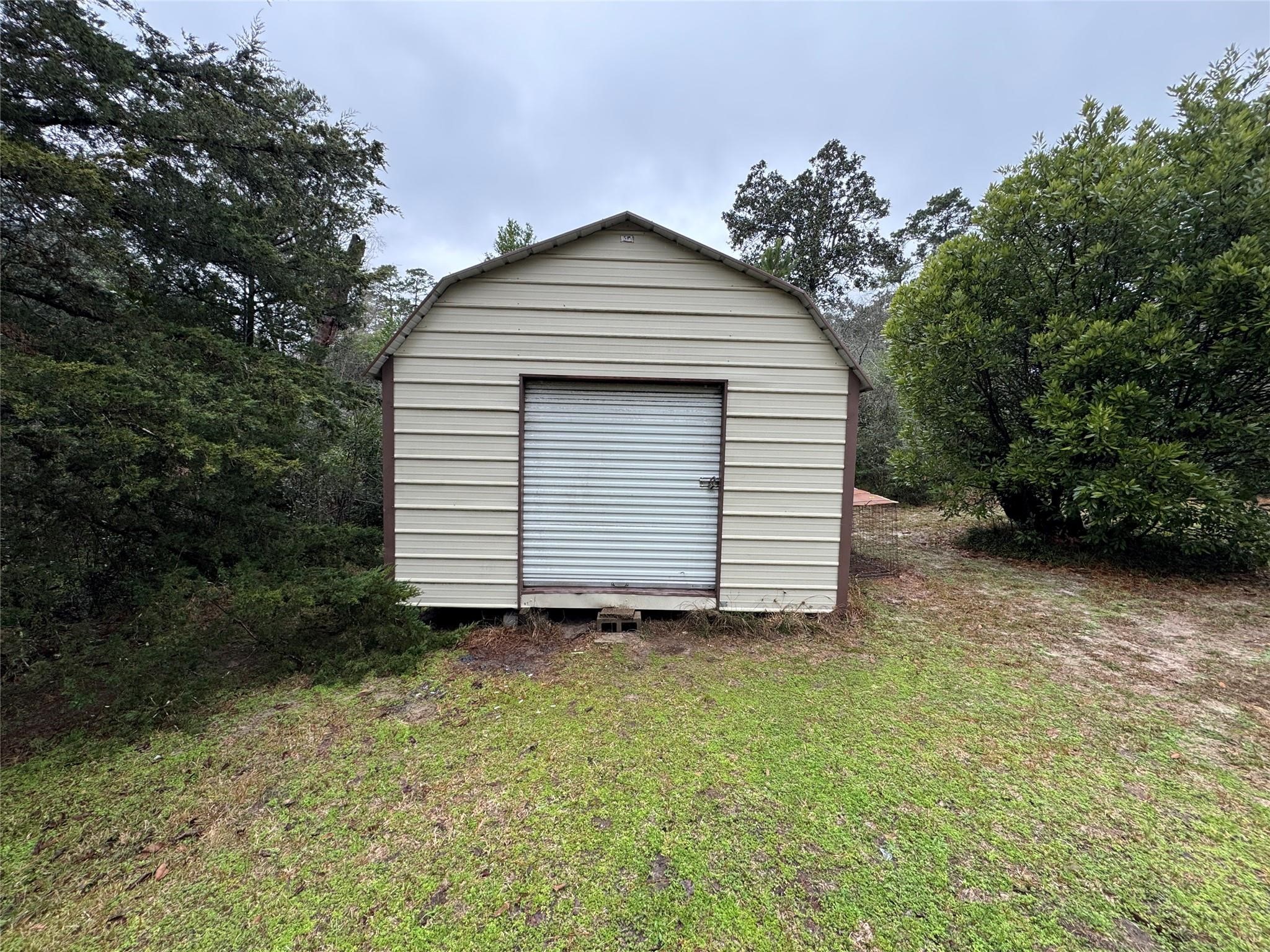257 County Road 2142 Cleveland, TX 77327 - Photo 8 of 18 a view of a house with a yard
