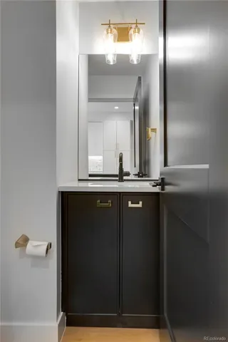 a bathroom with a mirror and a sink