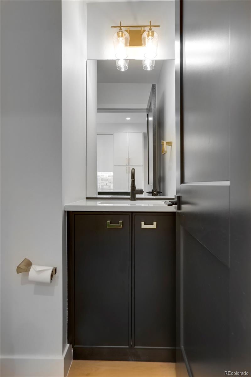 1065-25 25th Street, Unit A Denver, CO 80205 - Photo 14 of 45 a bathroom with a mirror and a sink