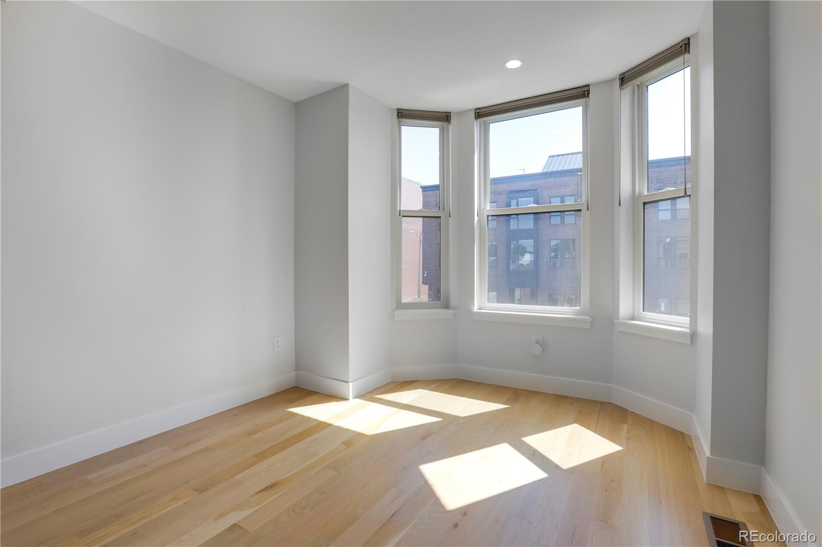 1065-25 25th Street, Unit A Denver, CO 80205 - Photo 15 of 45 a view of an empty room with a window