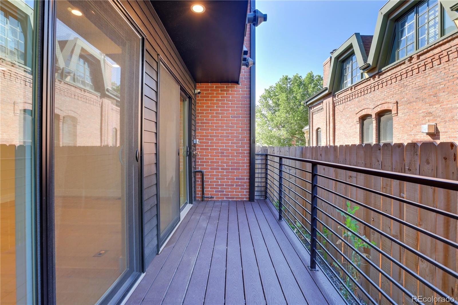 1065-25 25th Street, Unit A Denver, CO 80205 - Photo 17 of 45 a view of a house with wooden floor