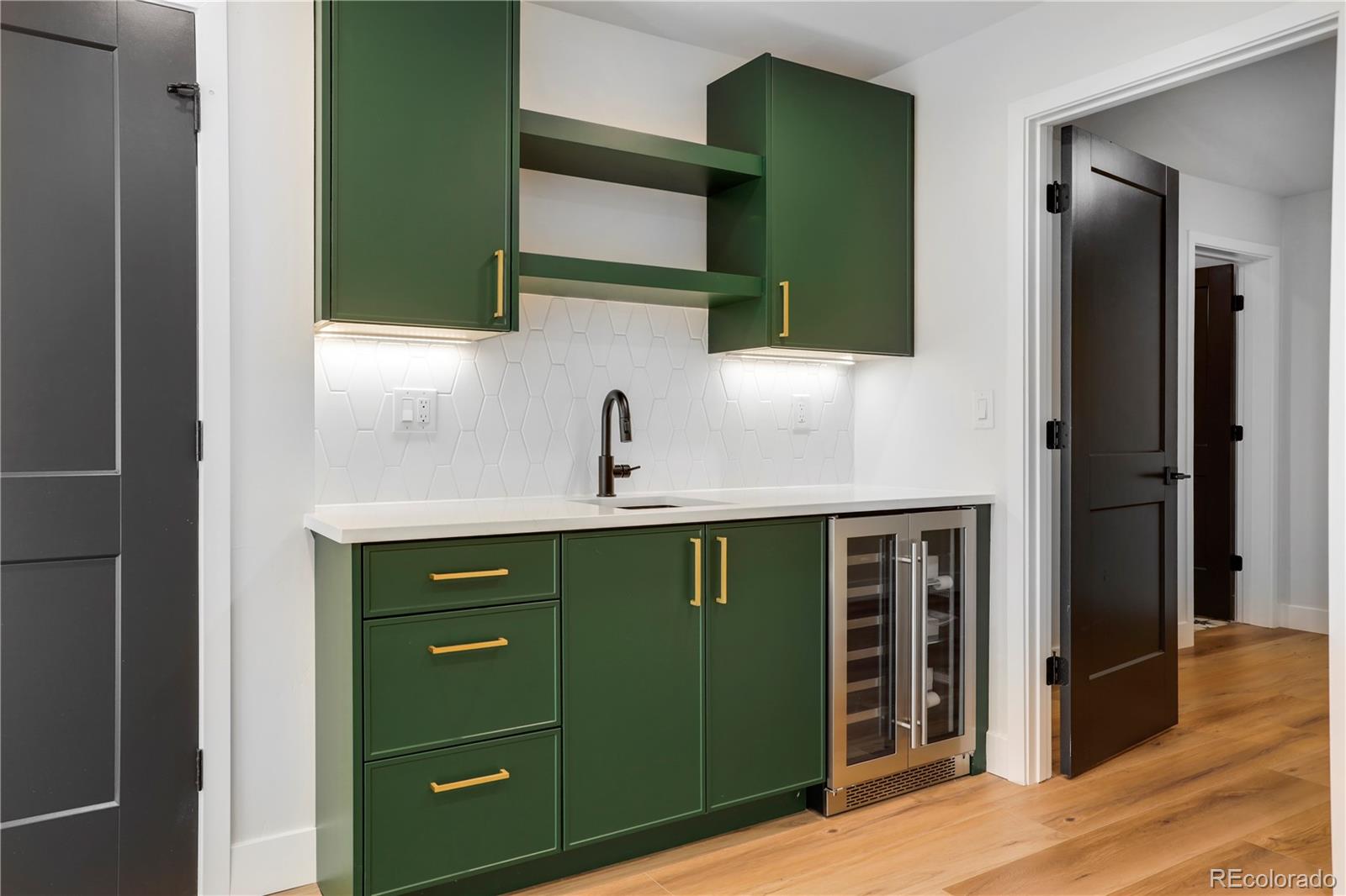 1065-25 25th Street, Unit A Denver, CO 80205 - Photo 32 of 45 a bathroom with a sink and a mirror