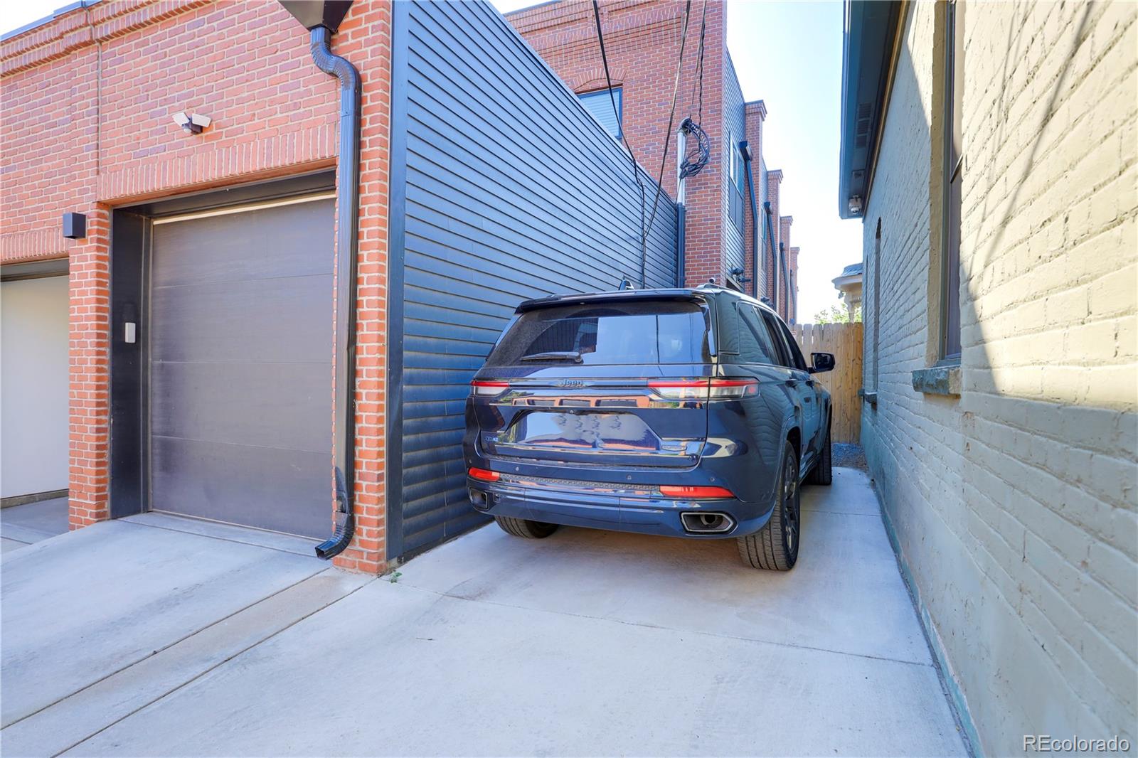 1065-25 25th Street, Unit A Denver, CO 80205 - Photo 36 of 45 a view of car parked in front of house
