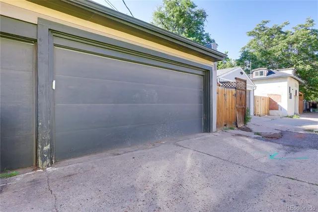 a view of backyard and garage