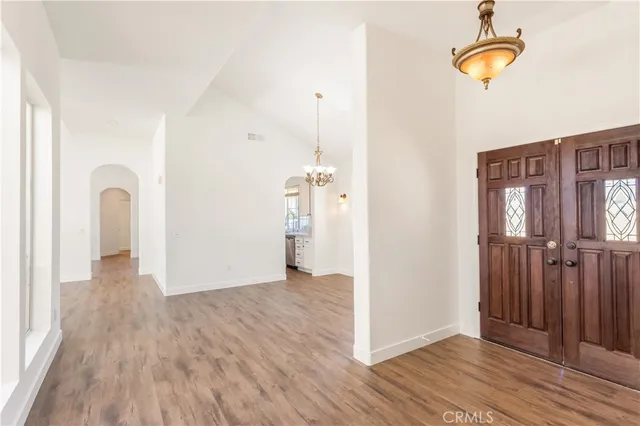 a view of a room with wooden floor