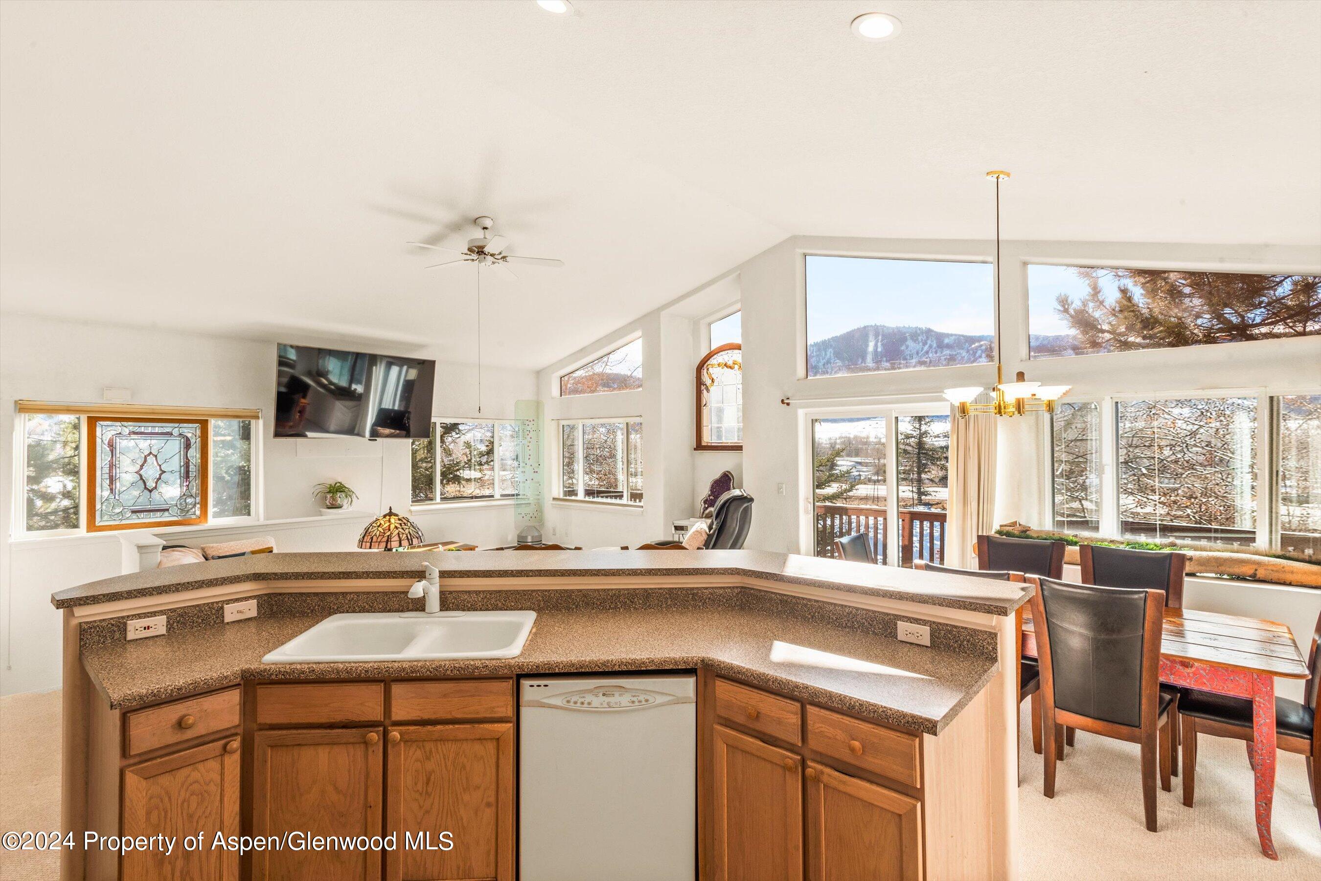 16 Pine Ridge Road Basalt, CO 81621 - Photo 12 of 63 a kitchen with a sink and large windows