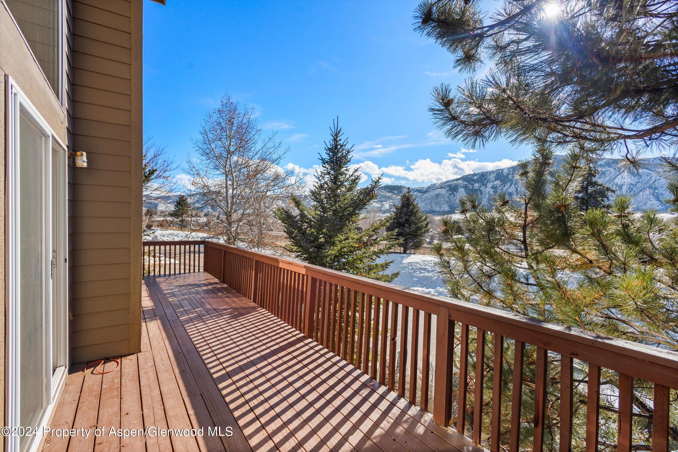 16 Pine Ridge Road Basalt, CO 81621 - Photo 20 of 63 a balcony with wooden floor and fence