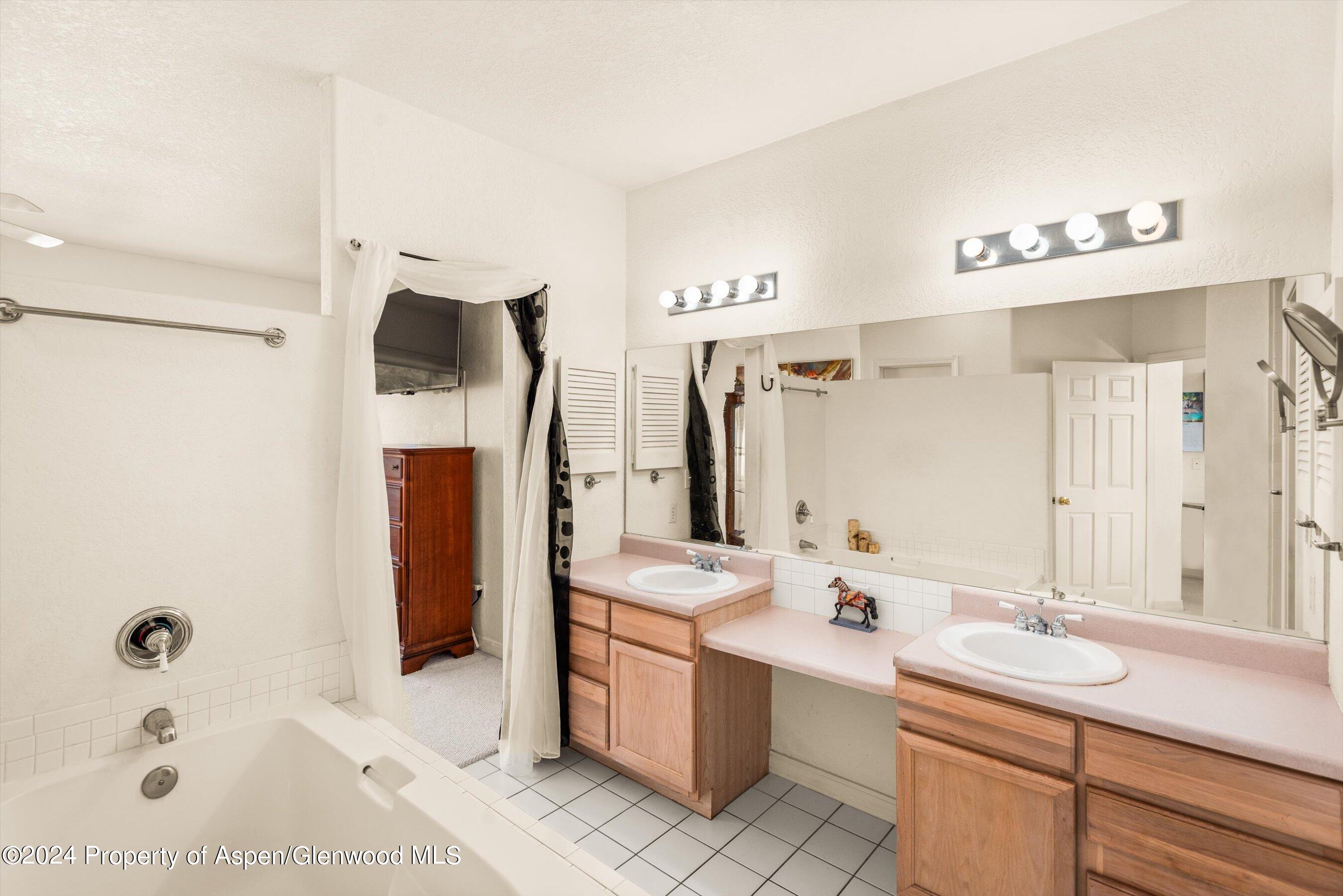 16 Pine Ridge Road Basalt, CO 81621 - Photo 35 of 63 a bathroom with a tub sink and mirror
