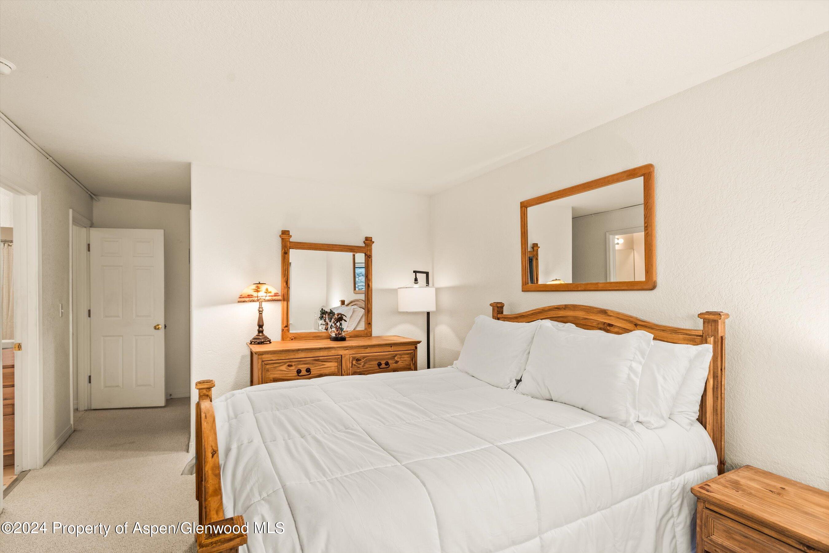 16 Pine Ridge Road Basalt, CO 81621 - Photo 63 of 63 a bedroom with a bed and a painting on the wall