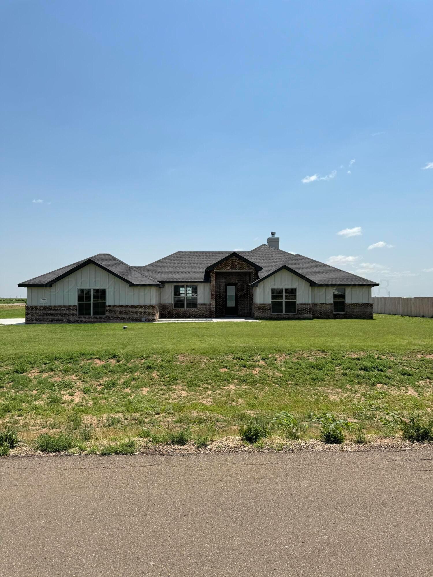 3801 Whitetail Springs Road Amarillo, TX 79119 - Photo 1 of 13 a front view of a house with garden