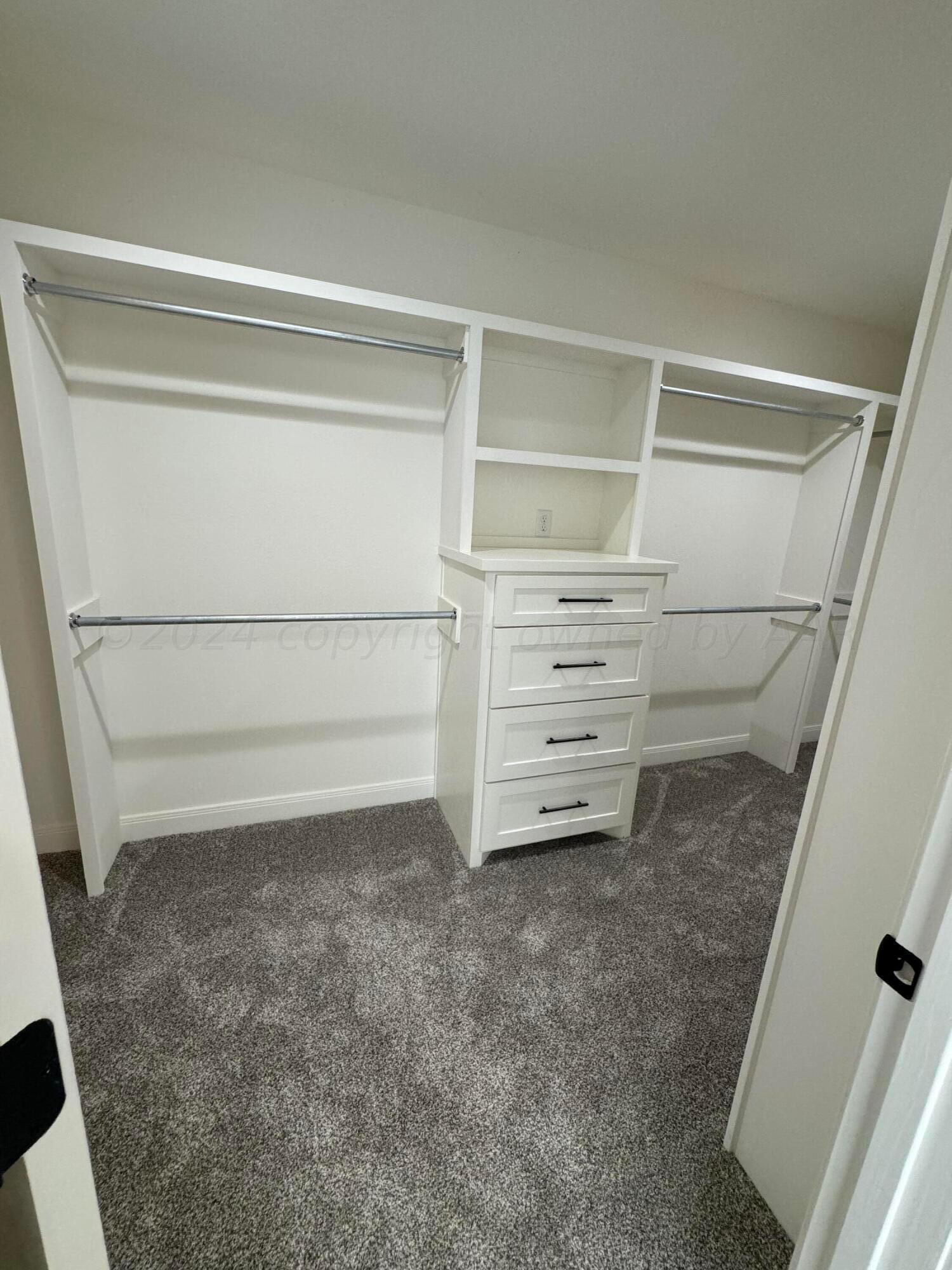 3801 Whitetail Springs Road Amarillo, TX 79119 - Photo 11 of 13 a view of an empty walk in closet