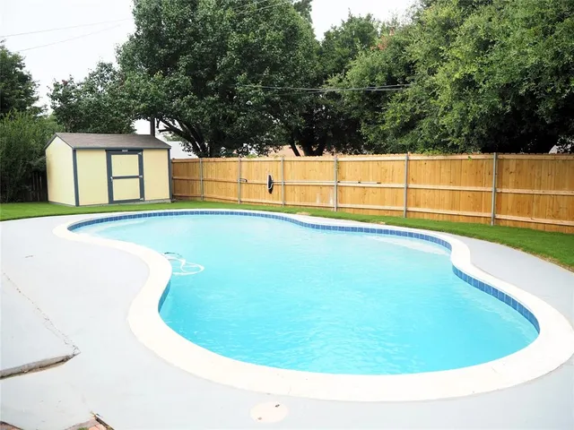 a view of outdoor space and swimming pool