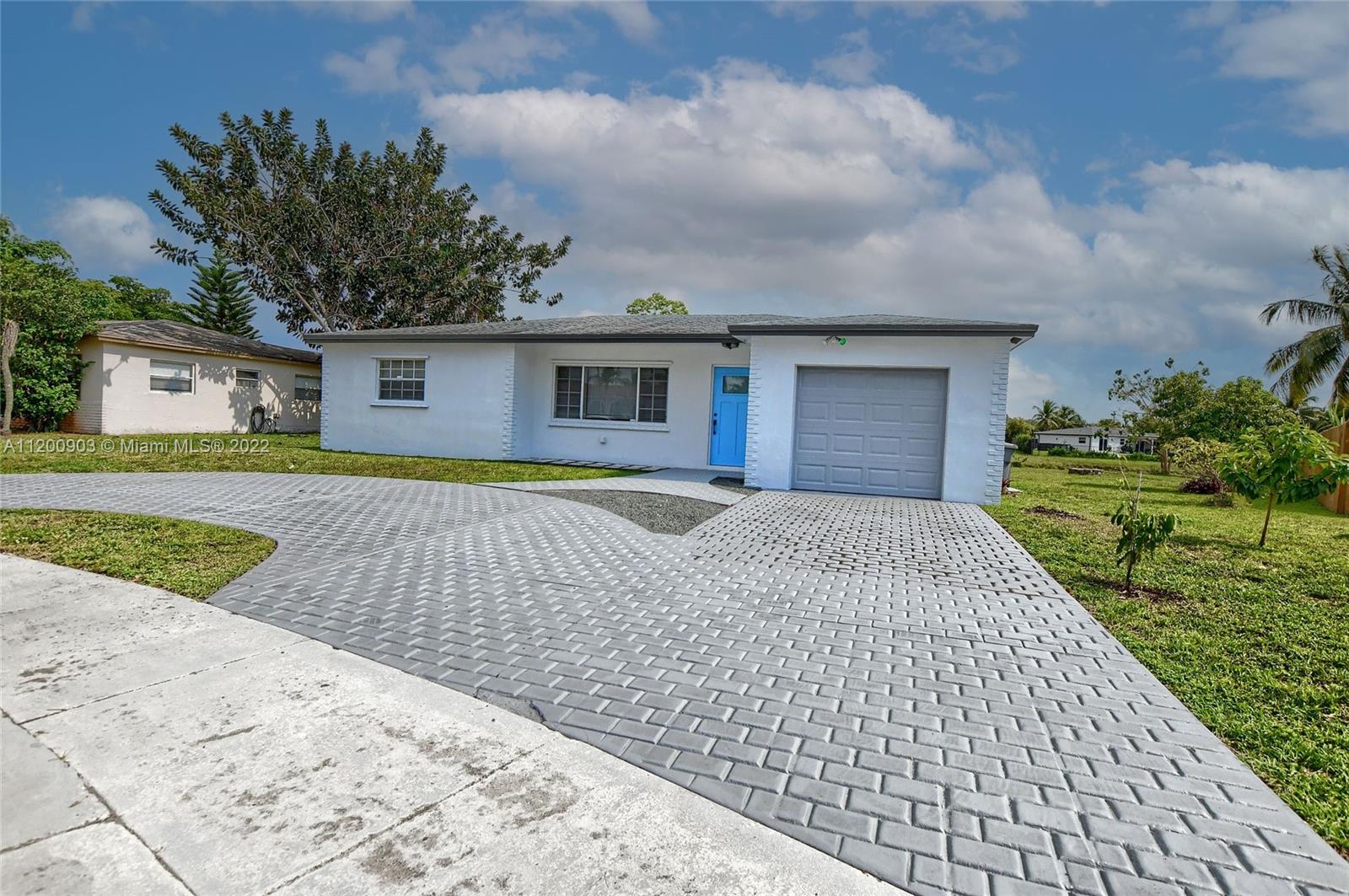 10950 Granite Street Boca Raton, FL 33428 - Photo 1 of 27 front view of a house with a yard