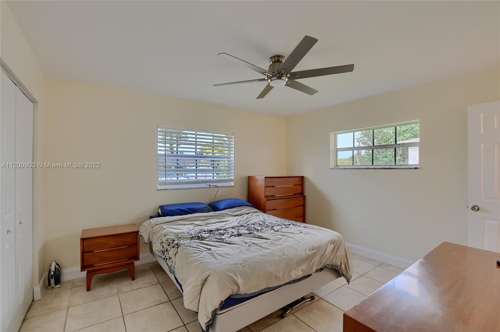 10950 Granite Street Boca Raton, FL 33428 - Photo 11 of 27 a bedroom with a large bed and a window