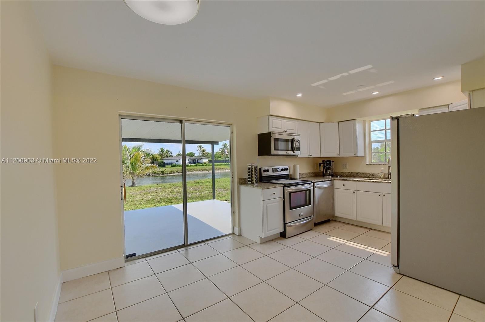 10950 Granite Street Boca Raton, FL 33428 - Photo 20 of 27 a kitchen with a sink a counter top space and appliances