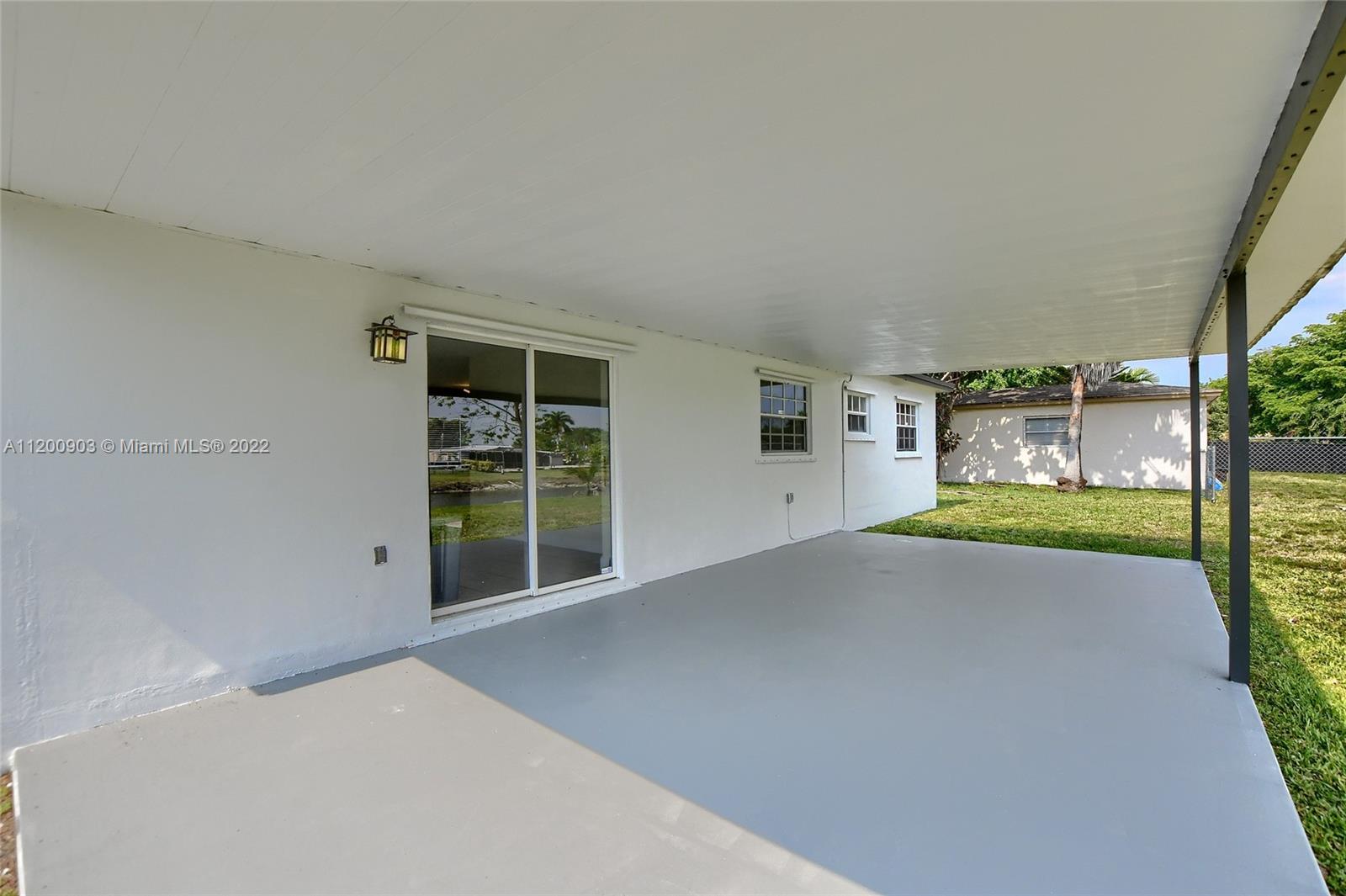 10950 Granite Street Boca Raton, FL 33428 - Photo 23 of 27 a view of an empty room with a fireplace