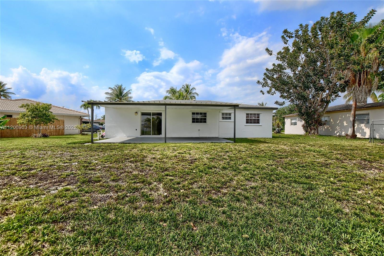 10950 Granite Street Boca Raton, FL 33428 - Photo 24 of 27 front view of house with a yard