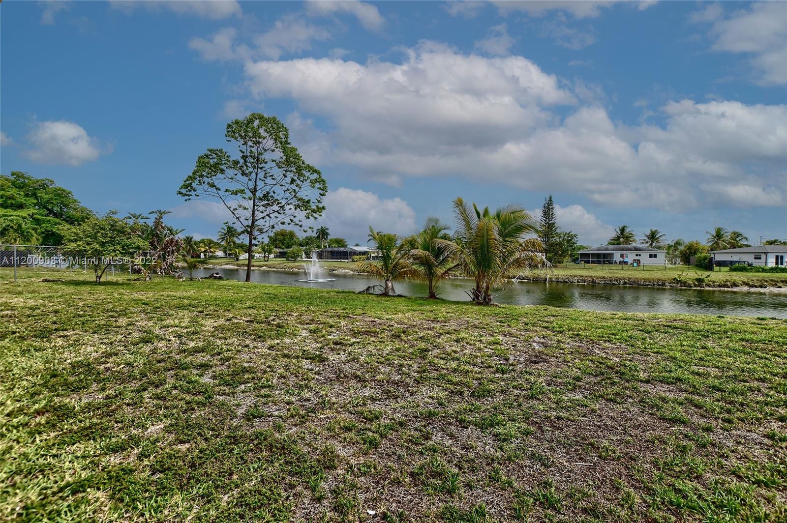 10950 Granite Street Boca Raton, FL 33428 - Photo 26 of 27 a large body of water with a building in the background
