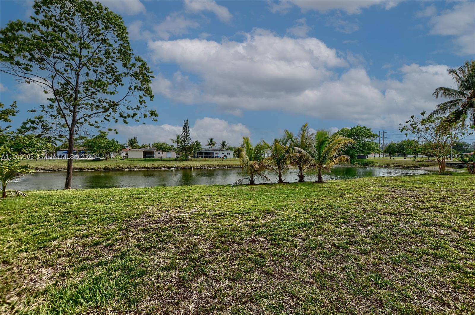 10950 Granite Street Boca Raton, FL 33428 - Photo 27 of 27 a view of a lake with a building in the background
