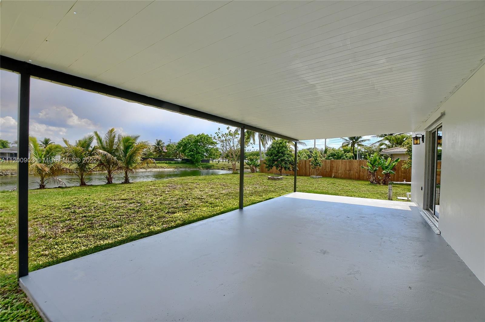 10950 Granite Street Boca Raton, FL 33428 - Photo 4 of 27 a view of a big room with a big yard