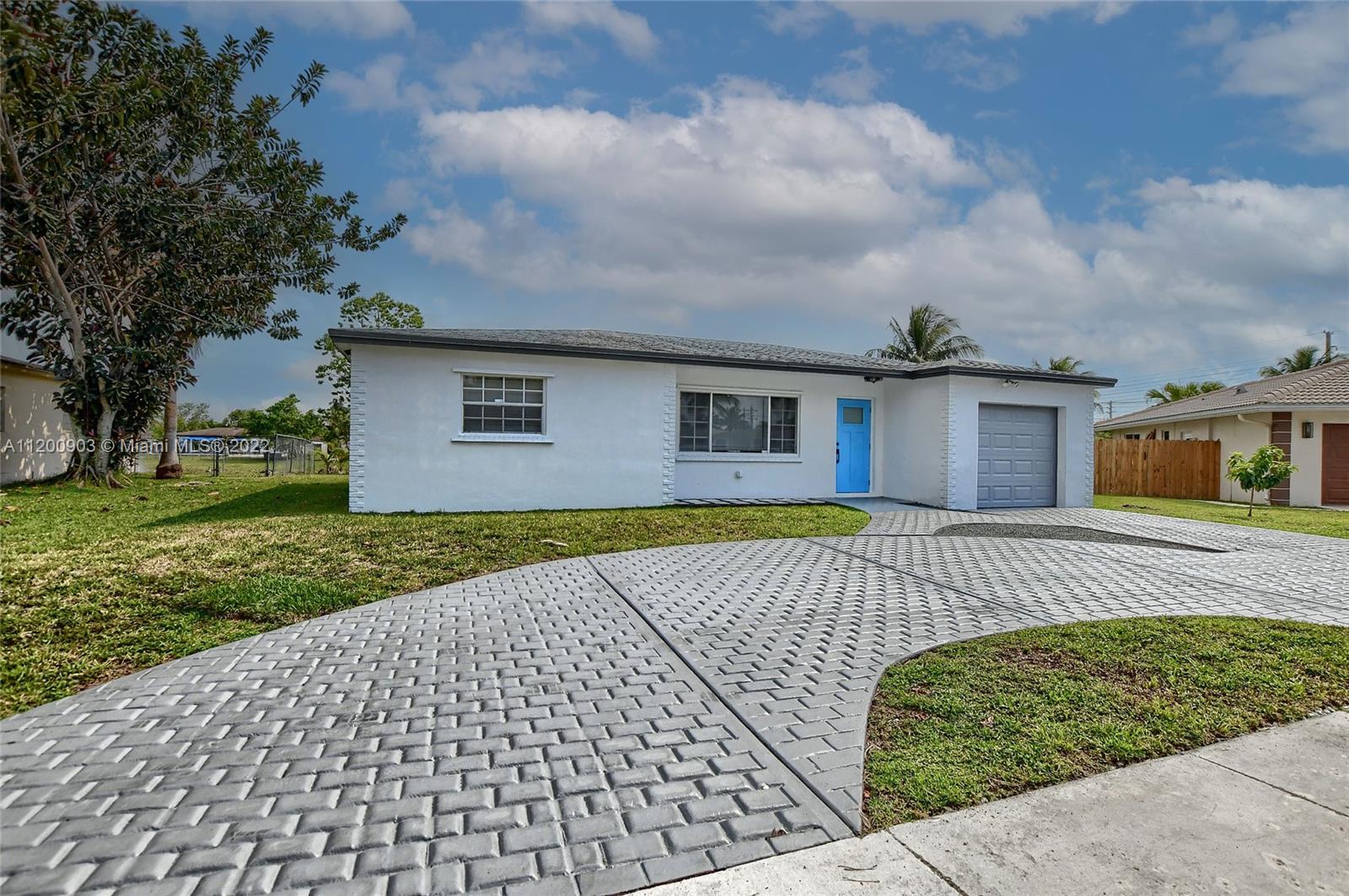 10950 Granite Street Boca Raton, FL 33428 - Photo 6 of 27 front view of house with a yard