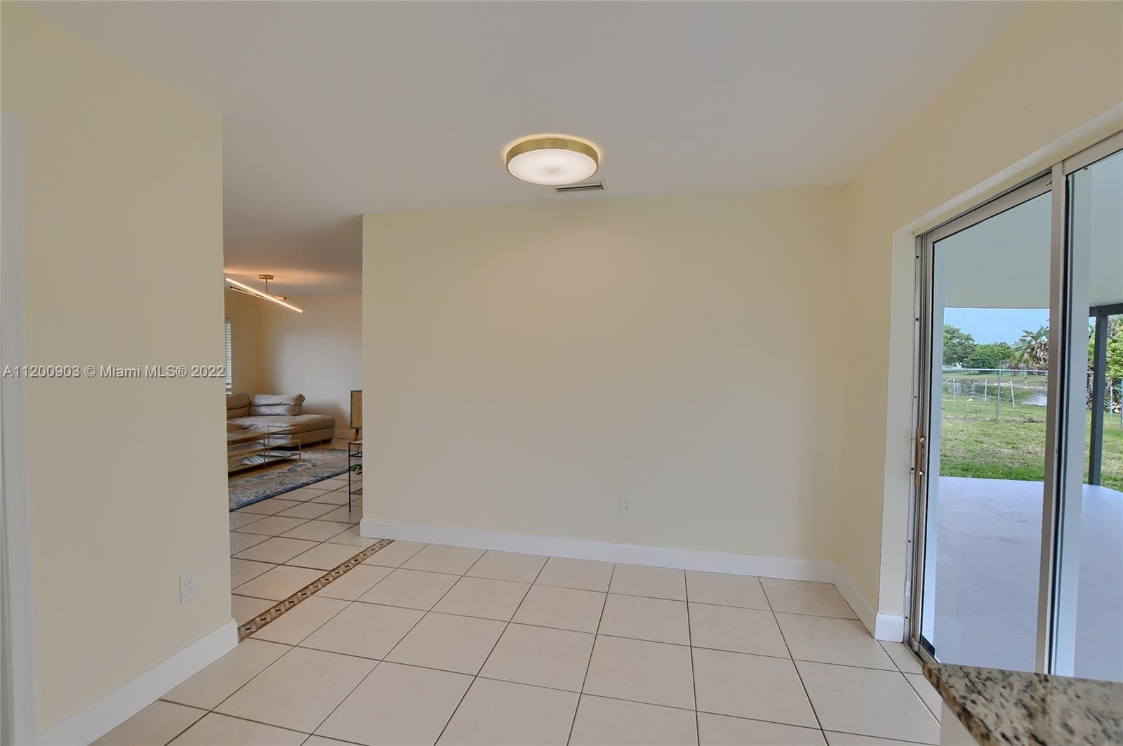 10950 Granite Street Boca Raton, FL 33428 - Photo 10 of 27 a view of an empty room and window