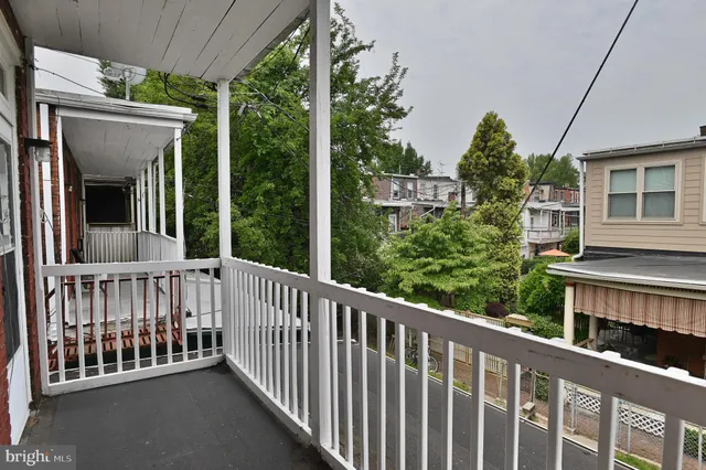 a view of a street from a balcony