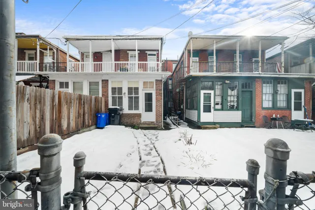 a view of a patio with table and chairs and potted plants