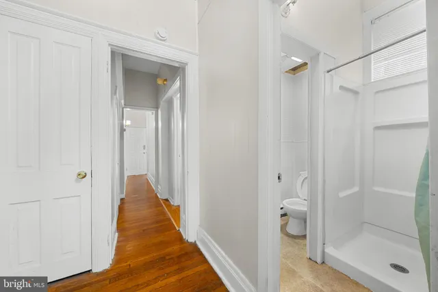 a view of a bathroom from a hallway