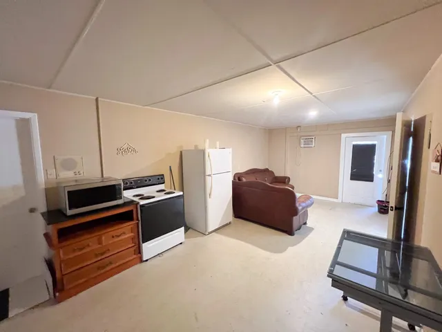a living room with a couch and a flat screen tv