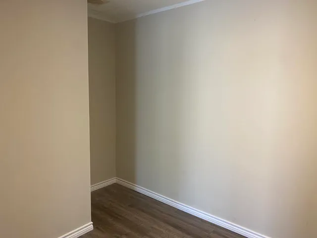 a view of small space with wooden floor