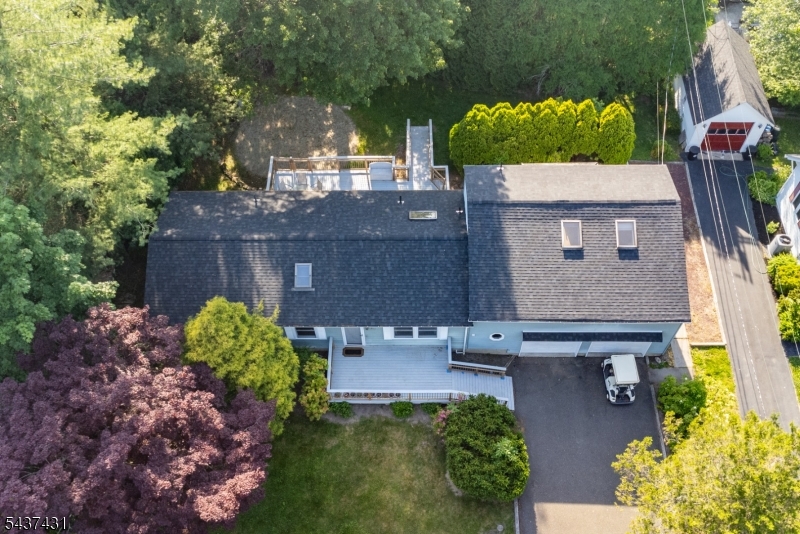 20 Wanaque Road West Milford, NJ 07421 - Photo 27 of 31 a view of a house with a yard and a large tree
