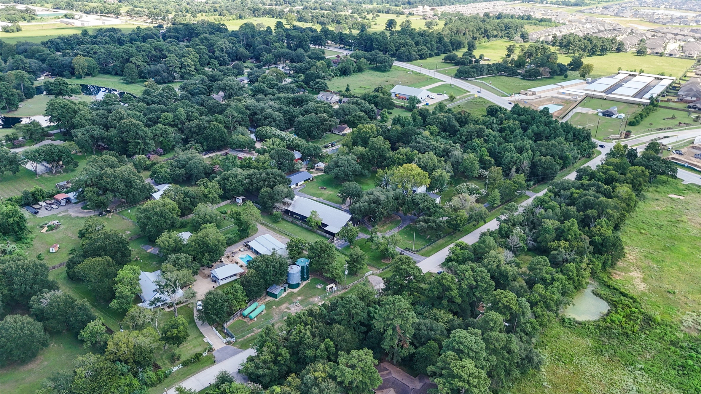 22111 Loblolly Road Tomball, TX 77377 - Photo 6 of 11 an aerial view of residential houses with outdoor space and trees