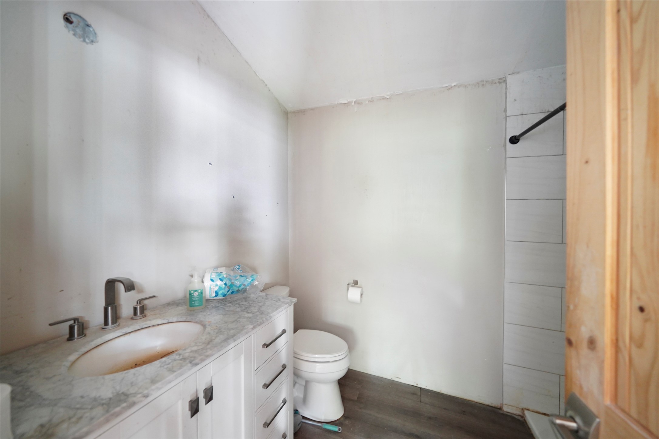 22111 Loblolly Road Tomball, TX 77377 - Photo 7 of 11 a bathroom with a granite countertop sink a toilet and a mirror
