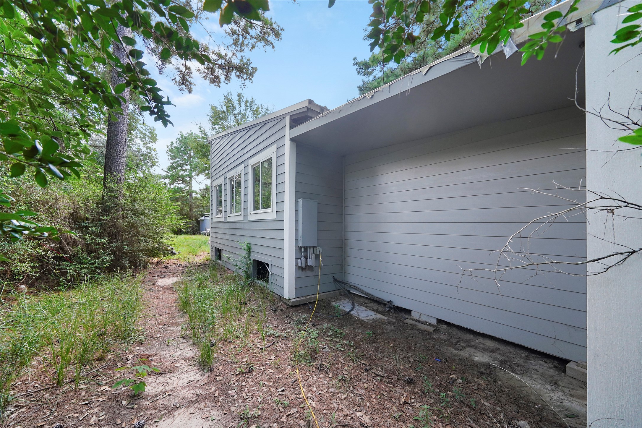 22111 Loblolly Road Tomball, TX 77377 - Photo 10 of 11 a backyard of a house with lots of green space