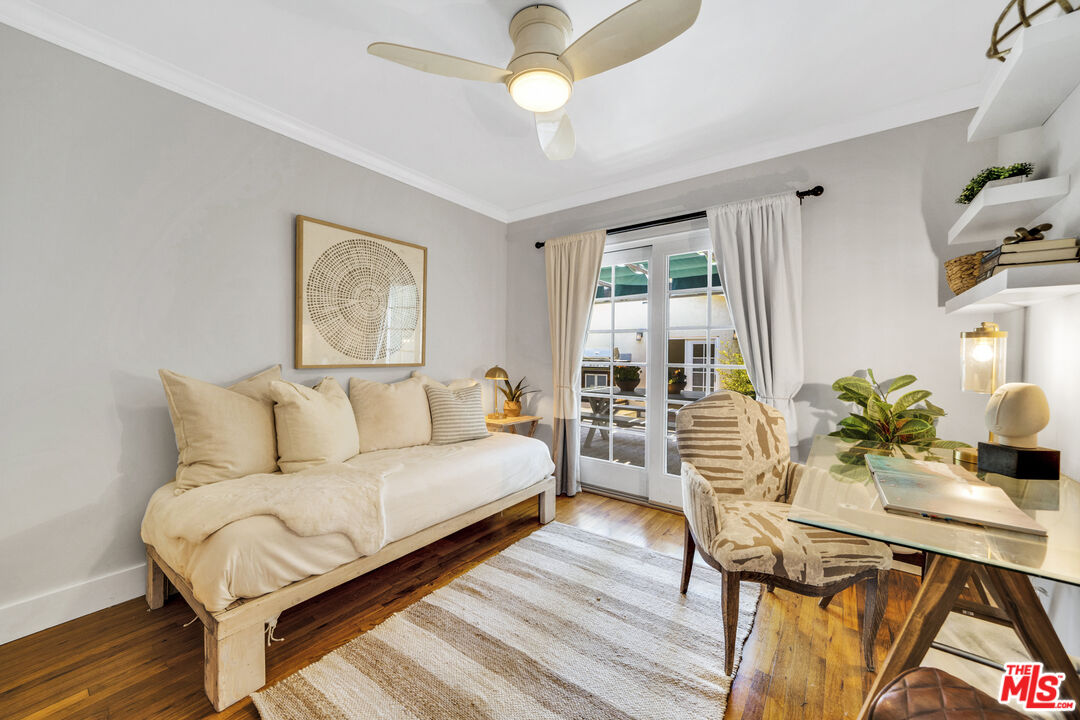 3448 Redwood Avenue Los Angeles, CA 90066 - Photo 16 of 25 a living room with furniture a chandelier and a rug