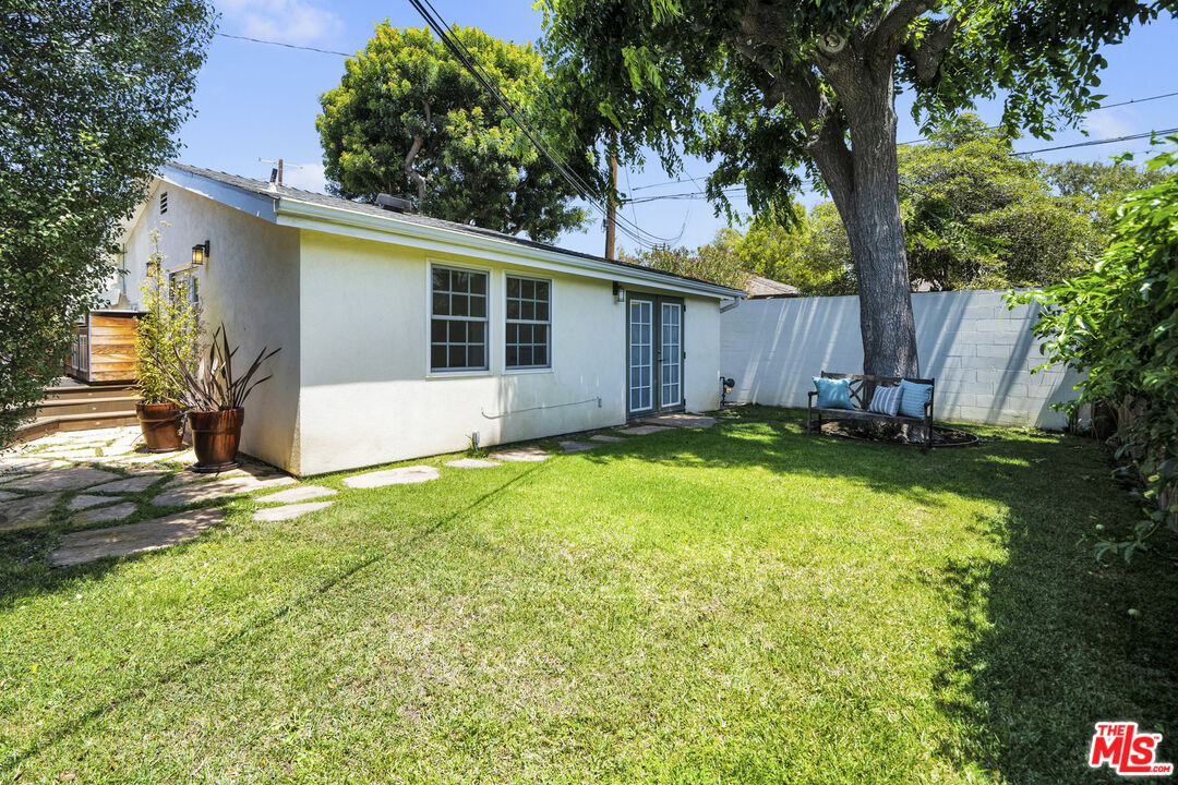 3448 Redwood Avenue Los Angeles, CA 90066 - Photo 20 of 25 a view of a house with a yard and tree