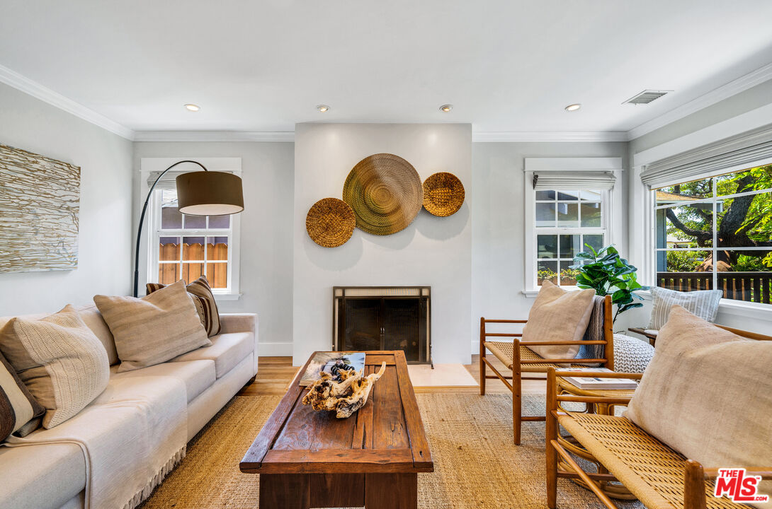 3448 Redwood Avenue Los Angeles, CA 90066 - Photo 2 of 25 a living room with furniture and a fireplace