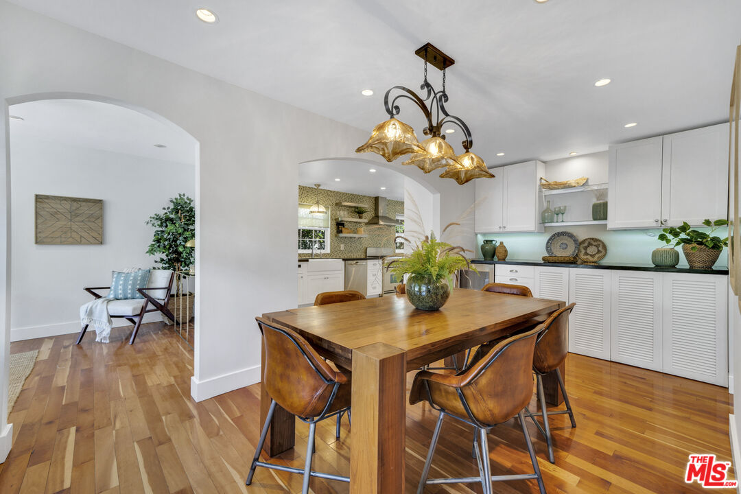 3448 Redwood Avenue Los Angeles, CA 90066 - Photo 7 of 25 a view of a dining room with furniture and wooden floor