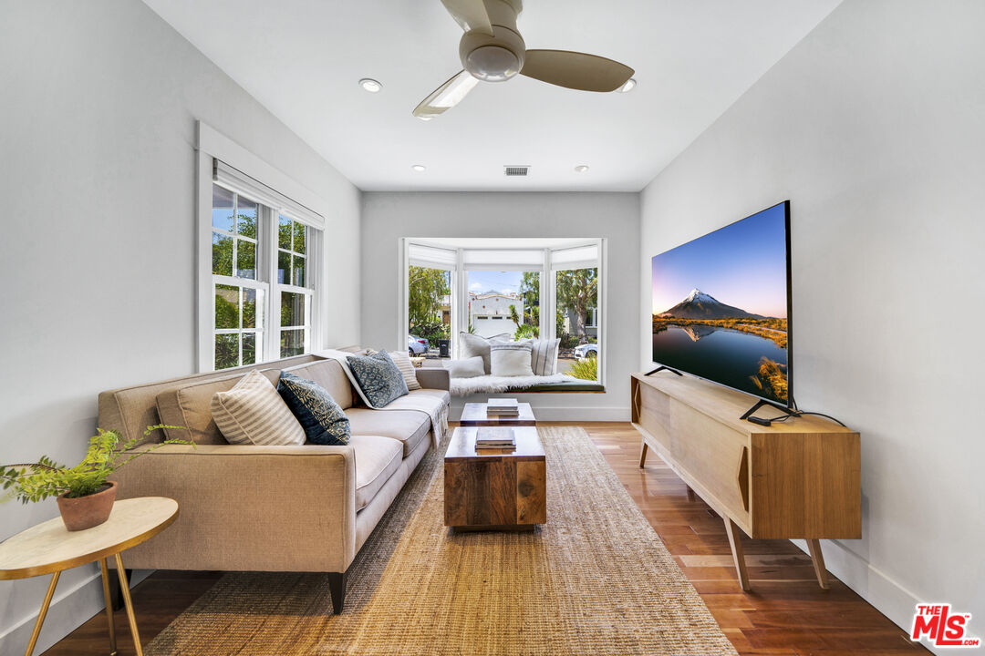 3448 Redwood Avenue Los Angeles, CA 90066 - Photo 8 of 25 a living room with furniture and a flat screen tv
