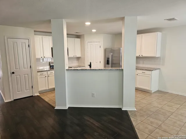 a view of kitchen with wooden floor