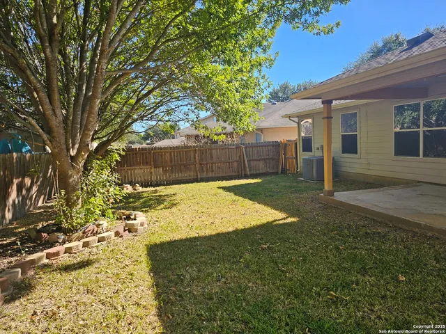 a view of a backyard of the house