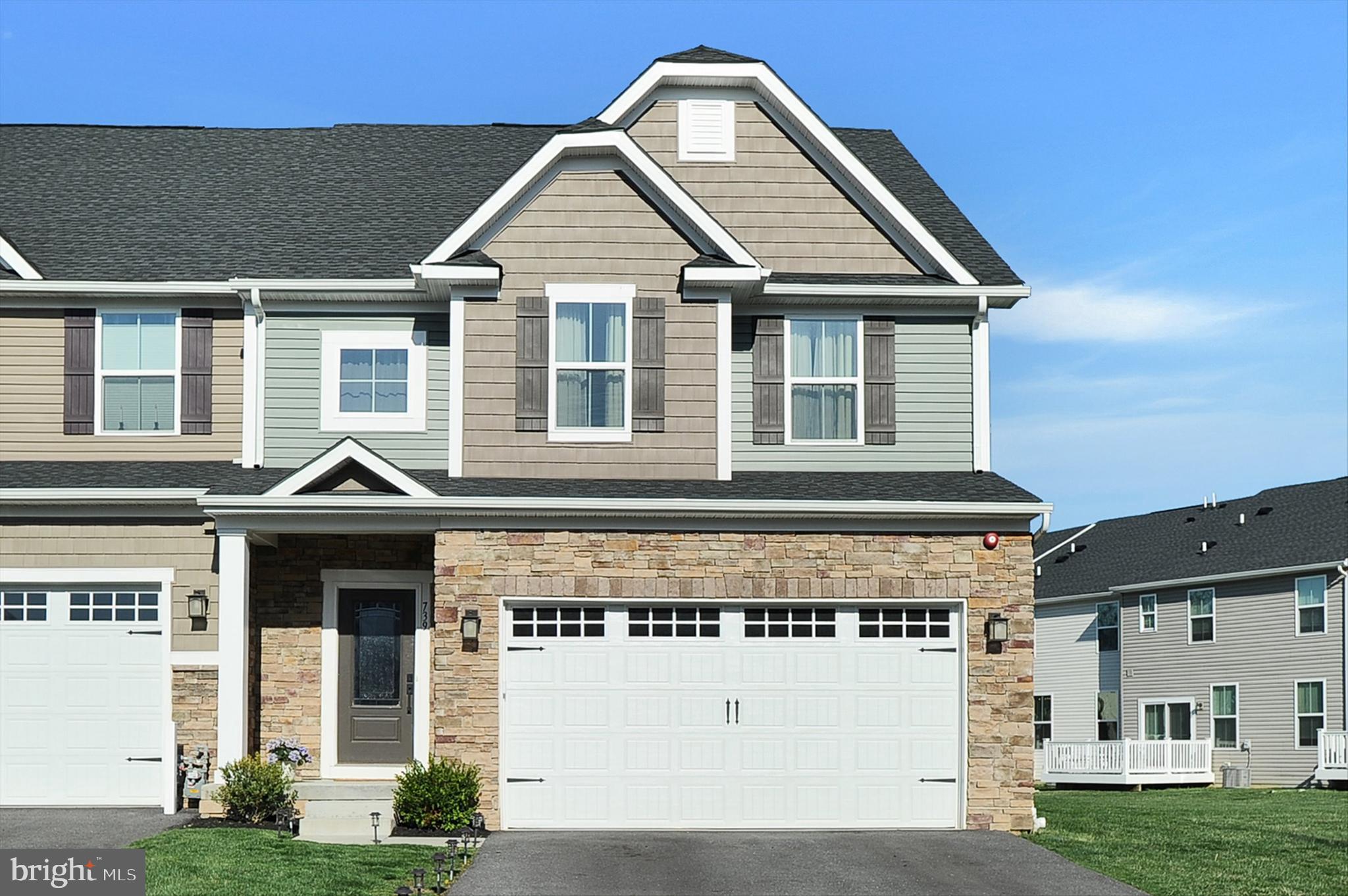 front view of a house with a yard