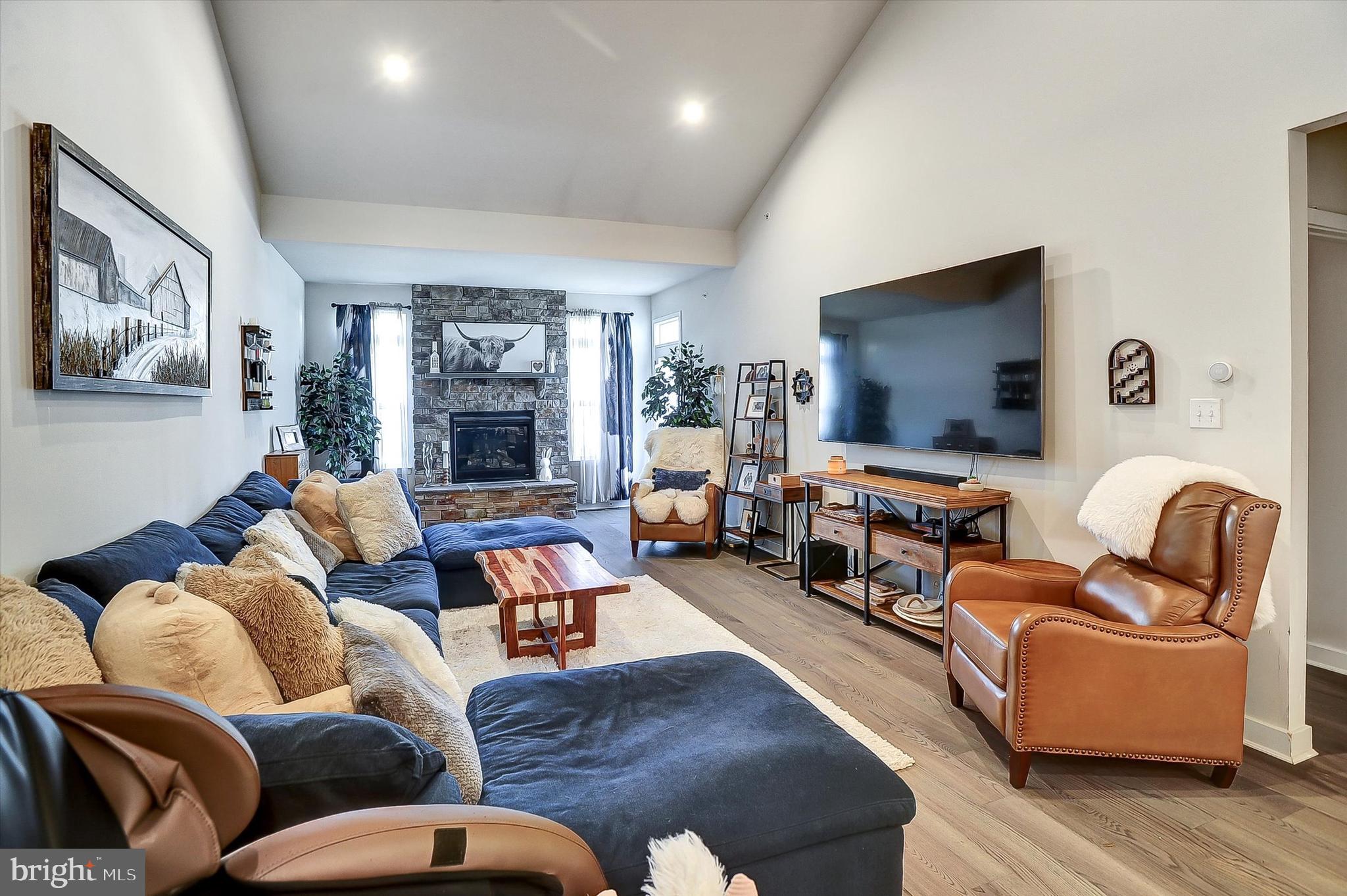 739 Cascade Way Kennett Square, PA 19348 - Photo 11 of 76 a living room with furniture fireplace and a flat screen tv