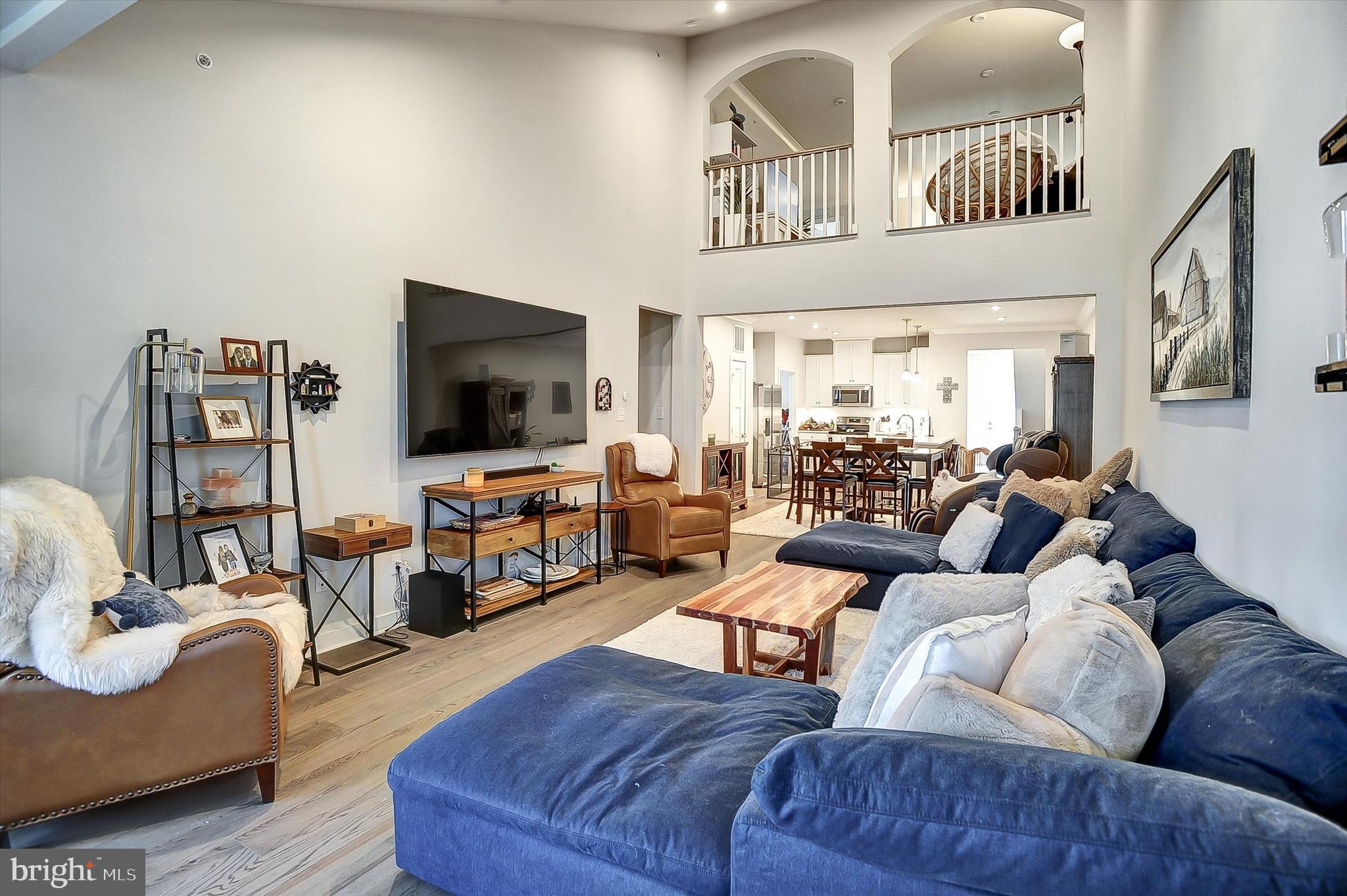 739 Cascade Way Kennett Square, PA 19348 - Photo 12 of 76 a living room with furniture and a flat screen tv