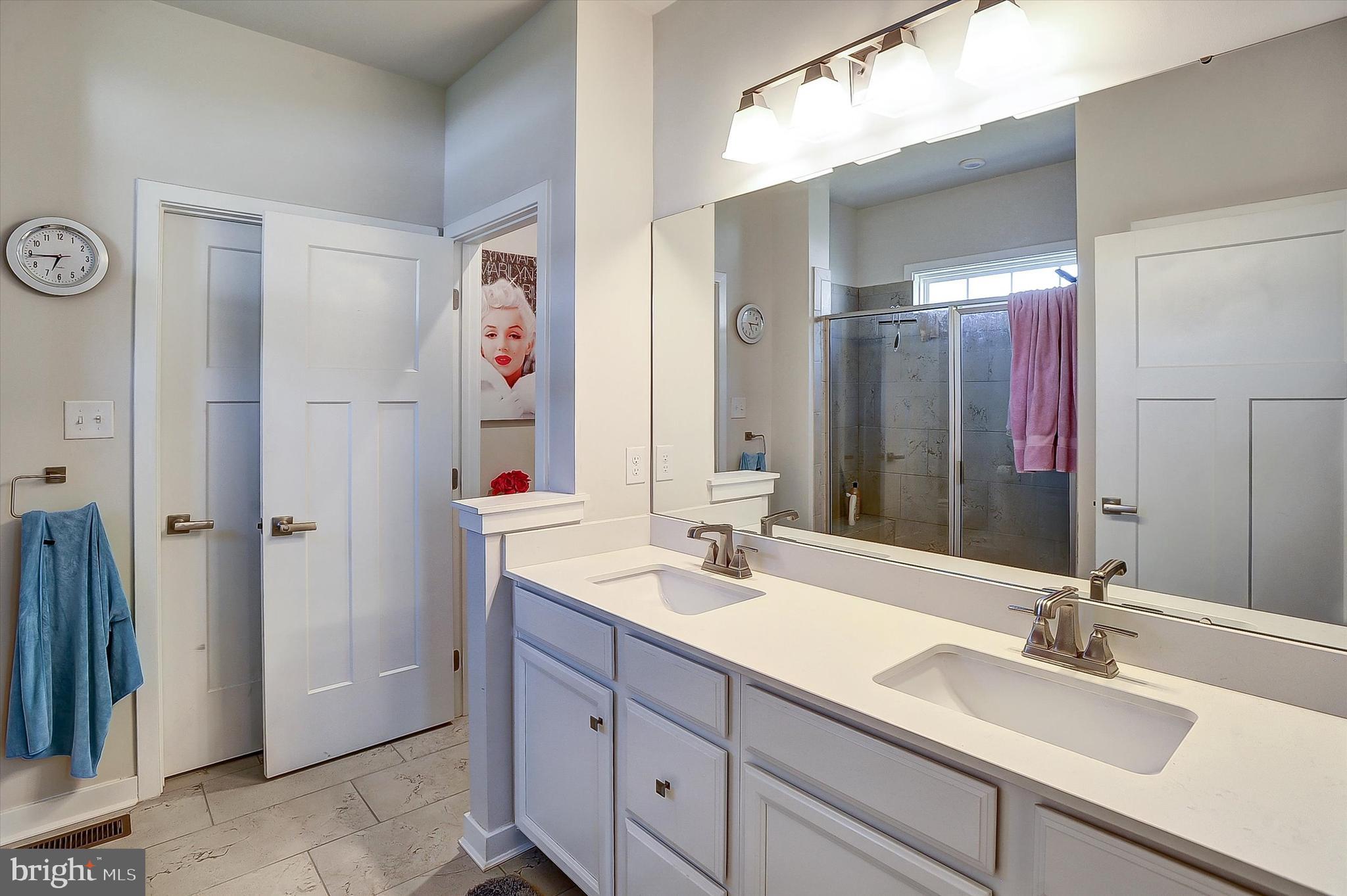 739 Cascade Way Kennett Square, PA 19348 - Photo 17 of 76 a bathroom with a double vanity sink mirror and double