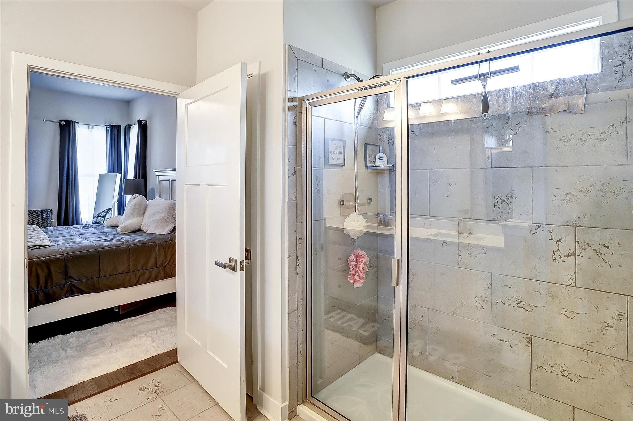 739 Cascade Way Kennett Square, PA 19348 - Photo 18 of 76 a bathroom with a shower and a sink