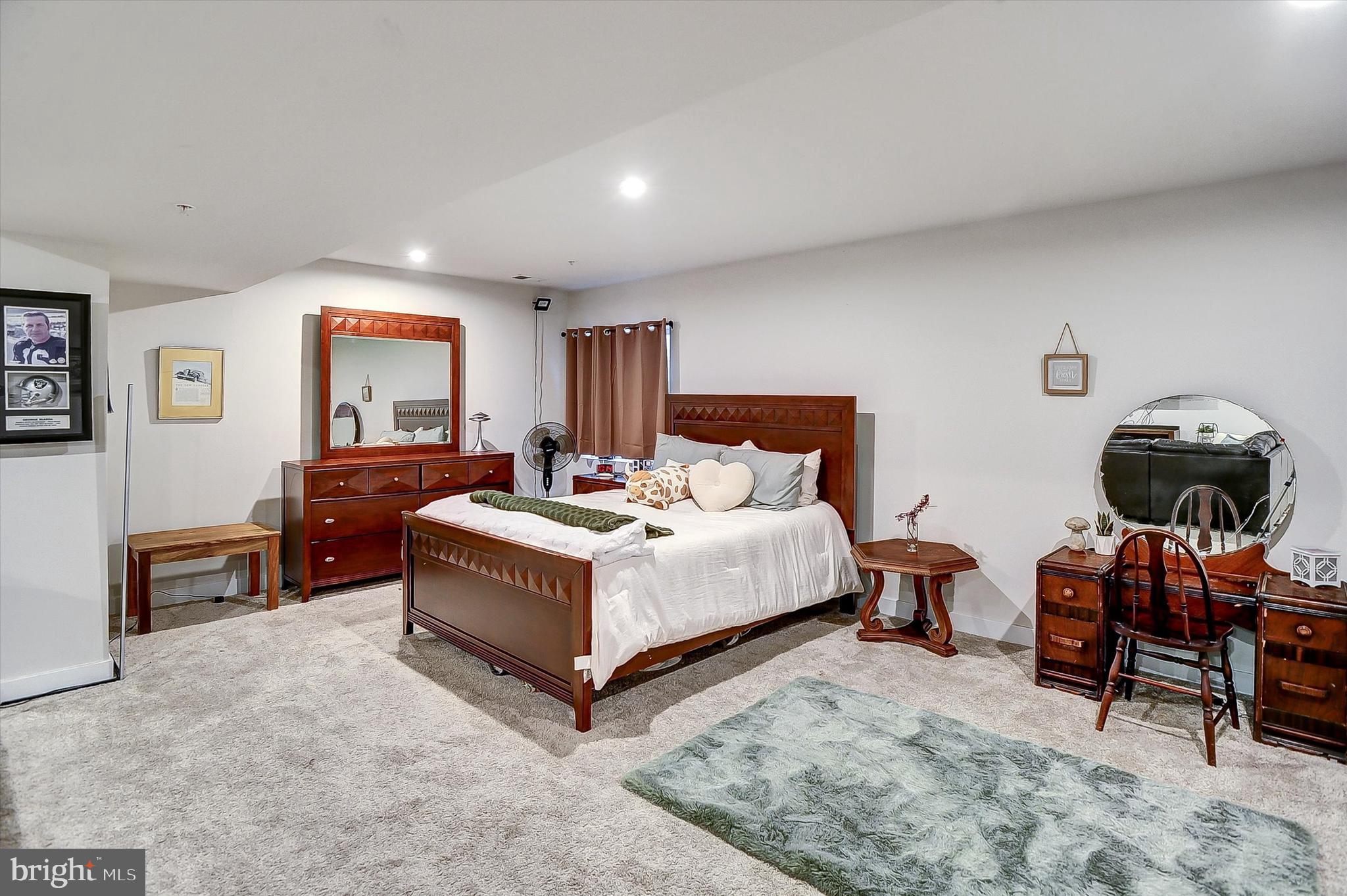 739 Cascade Way Kennett Square, PA 19348 - Photo 22 of 76 a spacious bedroom with a bed and a table in it