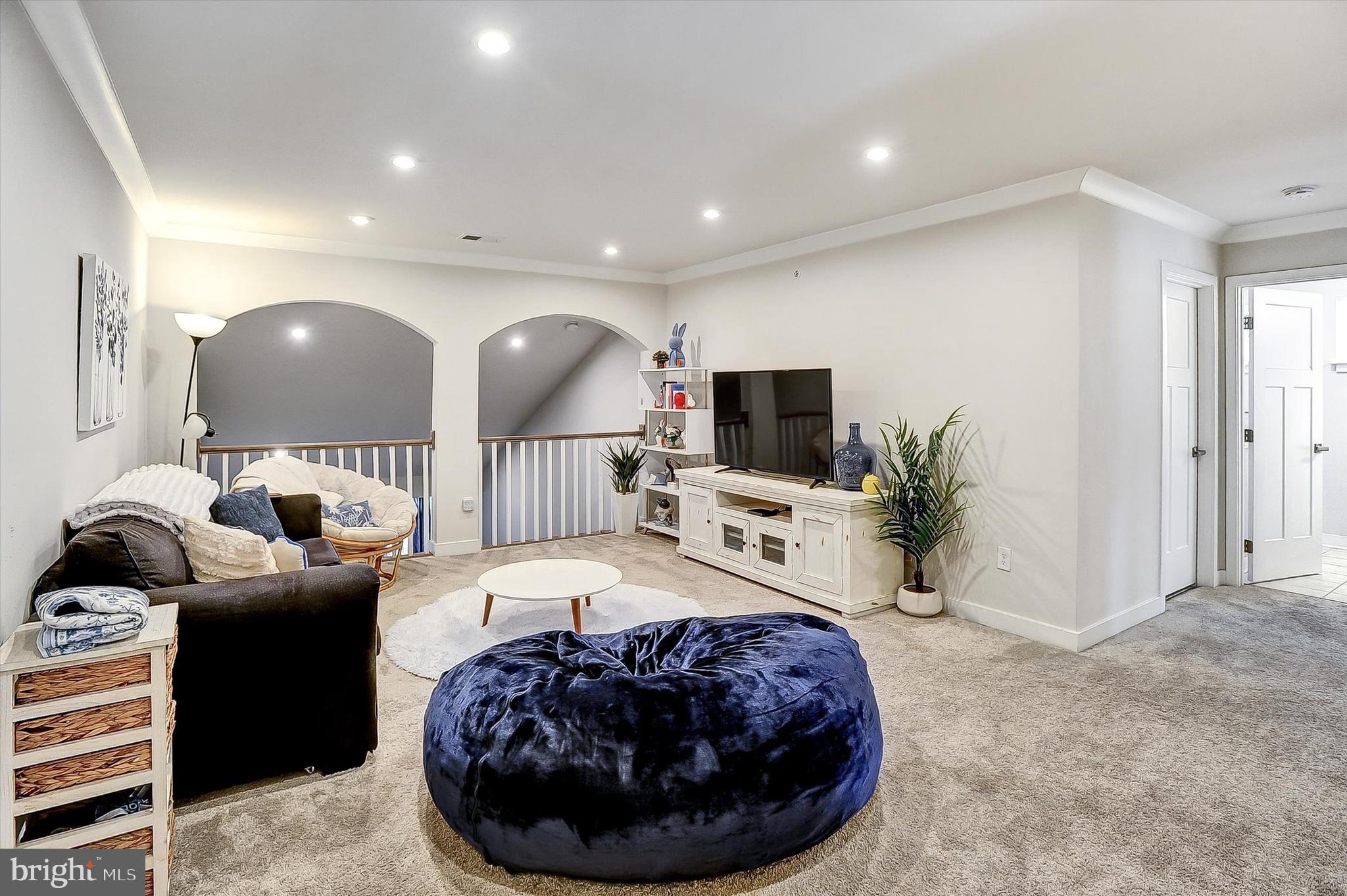739 Cascade Way Kennett Square, PA 19348 - Photo 24 of 76 a living room with furniture and a flat screen tv